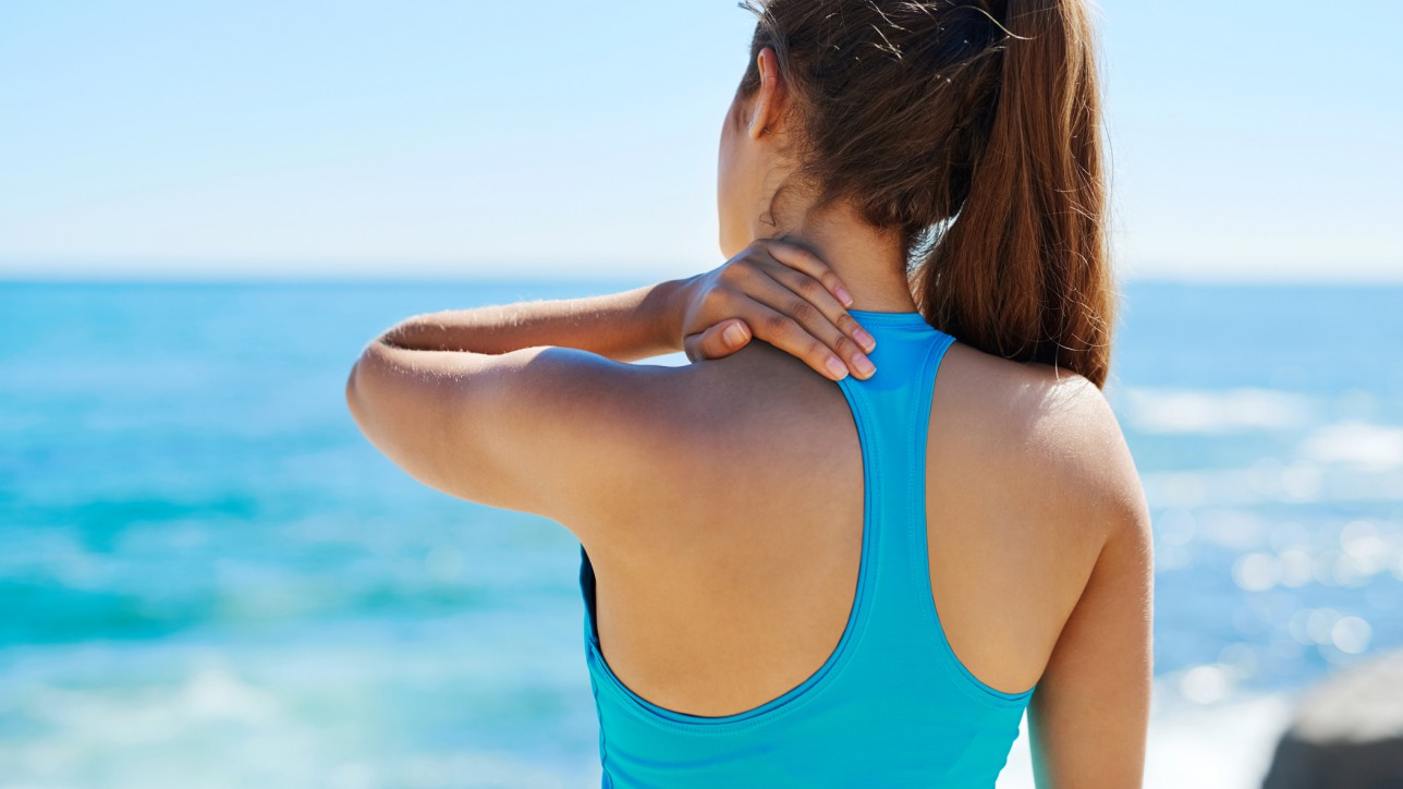 Shot of a sporty young woman exercising outside